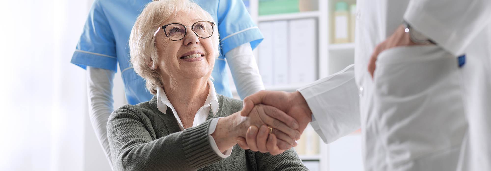 Caregiver Holding Patient's Hand